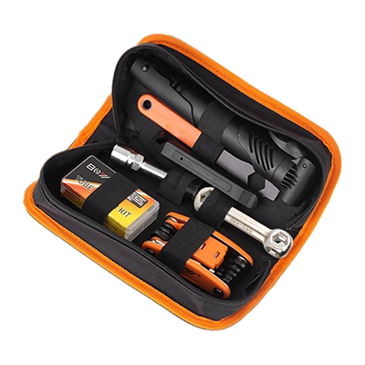 Bike repair kit contents including patches, wrenches, tire pump, and multitool
