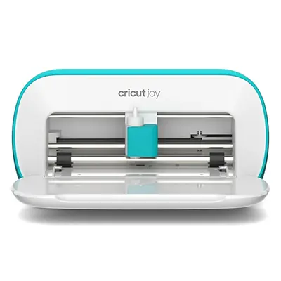  Cricut joy electronic cutting machine with cover open to reveal blade and rollers